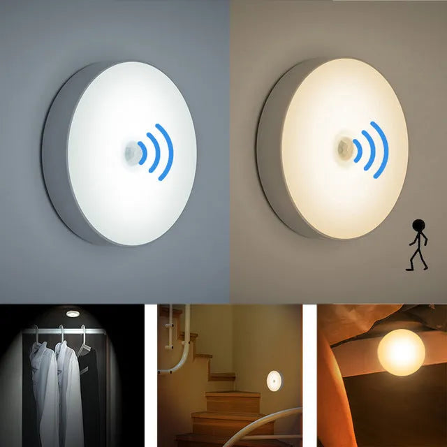Compact white motion-activated USB rechargeable LED night light with adhesive tape.