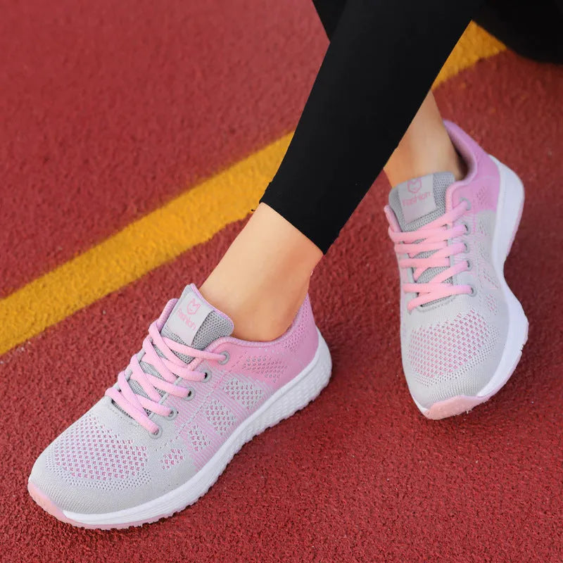 Women's white high-top lace-up casual sneakers with a cross-binding strap detail.