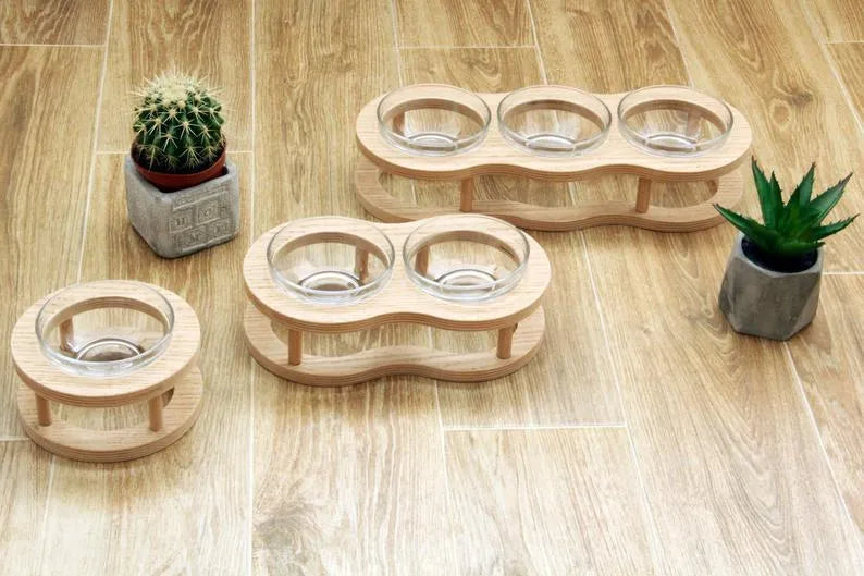 Wooden raised pet bowl stand with glass bowls, available in small, medium and large sizes for cats and small dogs.