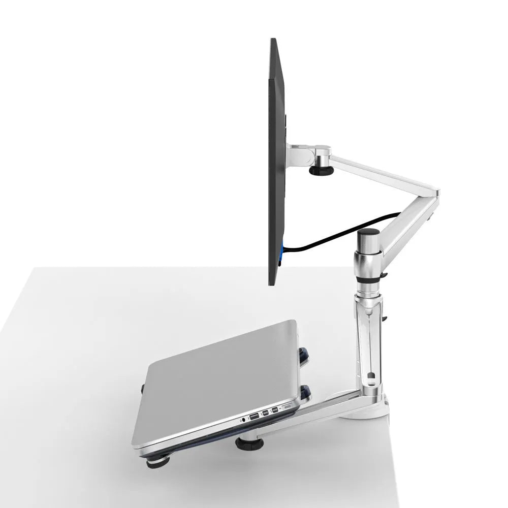 Silver metal dual-purpose bracket holding a notebook and monitor on a desk with adjustable arm