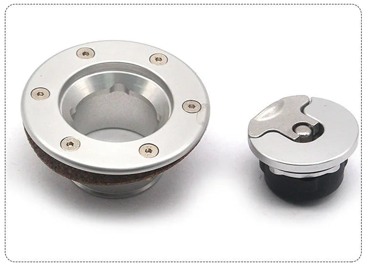 Silver aluminium alloy fuel tank cap designed for universal car fitment.