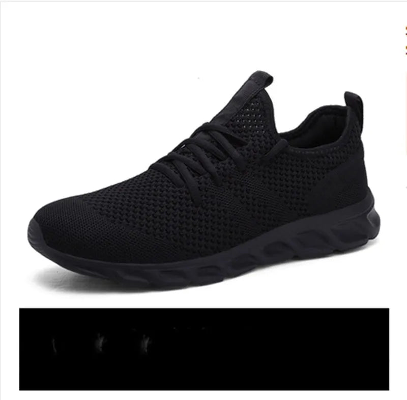Men's black and white lace-up sneaker with mesh upper and round toe design