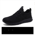 Men's black and white lace-up sneaker with mesh upper and round toe design