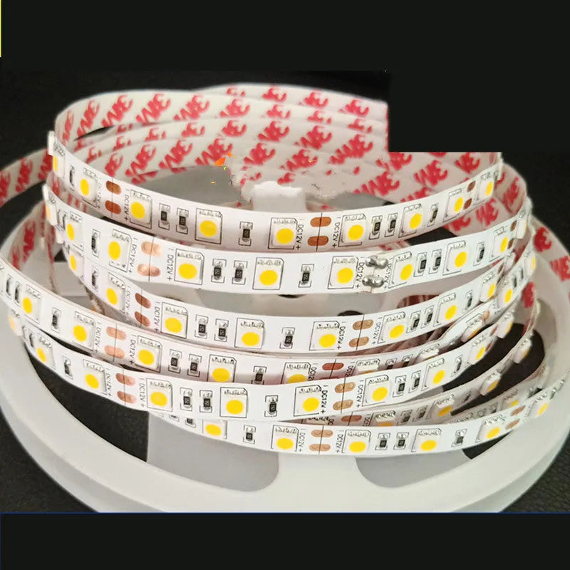 Close-up of a flexible 12V white LED light strip, showing either 2835 or 5050 LEDs, for counter and shelf lighting.