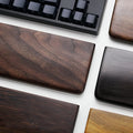 Solid black walnut wood wrist rest for a 60% mechanical keyboard, 30cm long.