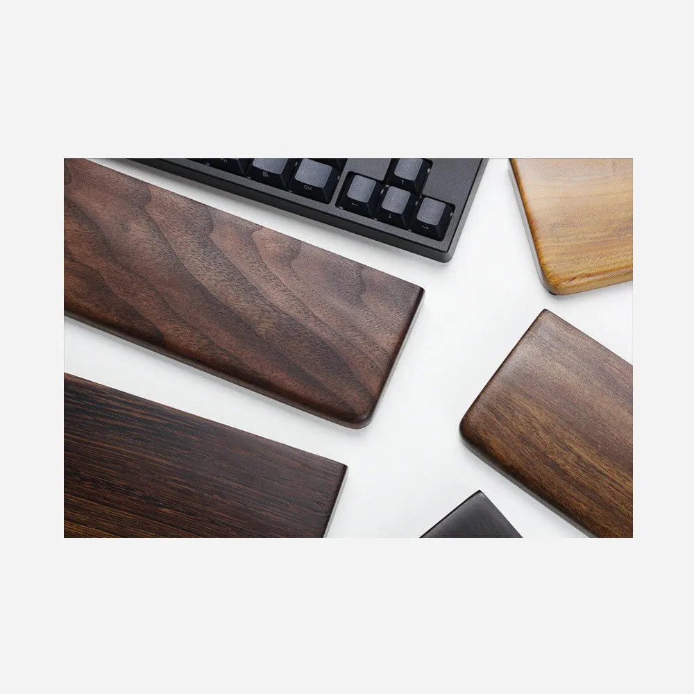 Solid black walnut wood wrist rest for a 60% mechanical keyboard, 30cm long.