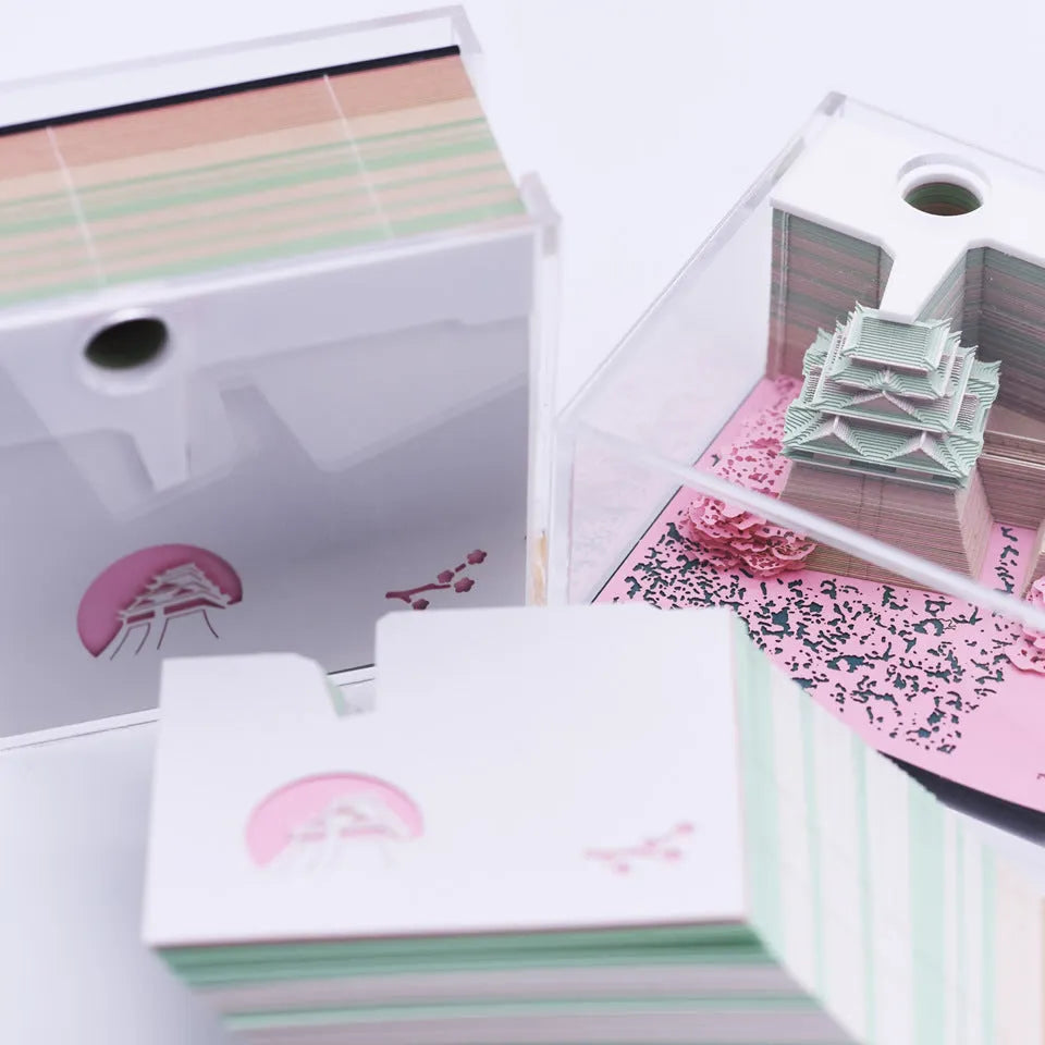 Three-dimensional white specialty paper architectural model of the Tianshou Tower from Spirited Away.
