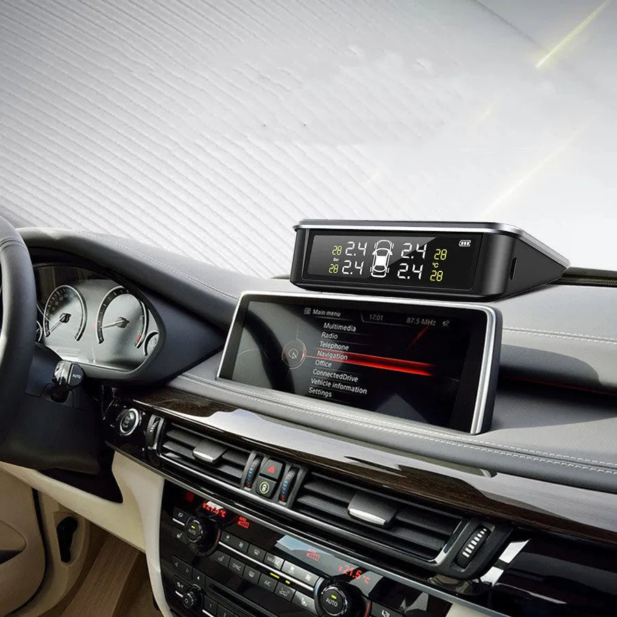 Vehicle tyre pressure monitoring system with digital colour display and external sensors on a car dashboard