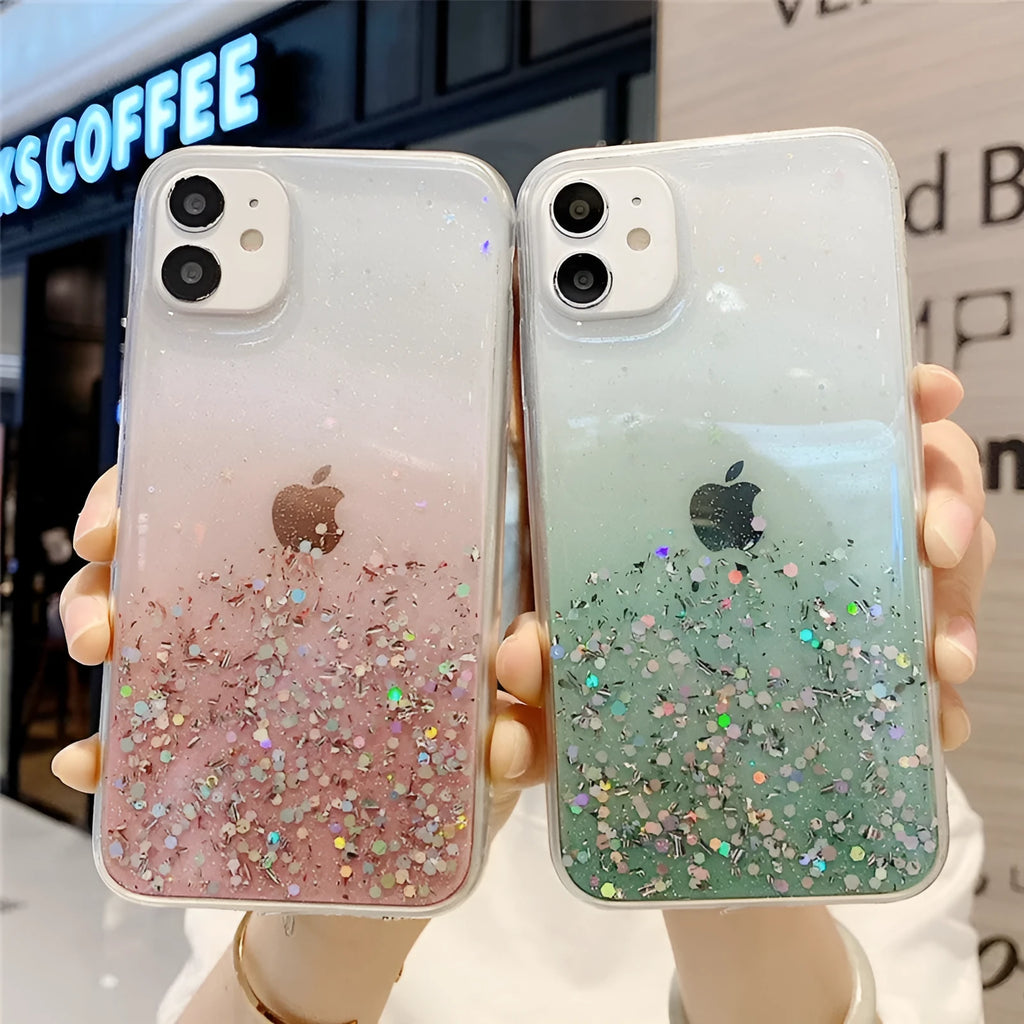 Glitter epoxy transparent phone case for iPhone 11 and iPhone 12 models on a table.