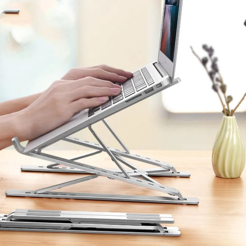 Double-layer aluminium alloy foldable laptop stand in silver, height adjustable from 25 to 310 mm