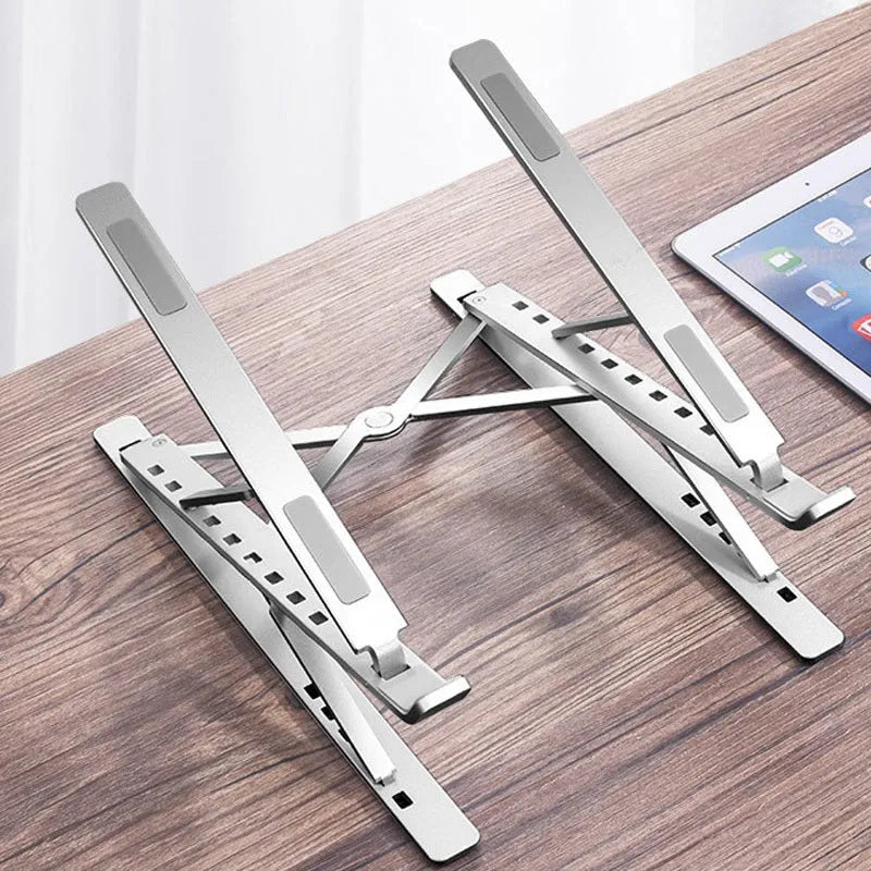 Double-layer aluminium alloy foldable laptop stand in silver, height adjustable from 25 to 310 mm