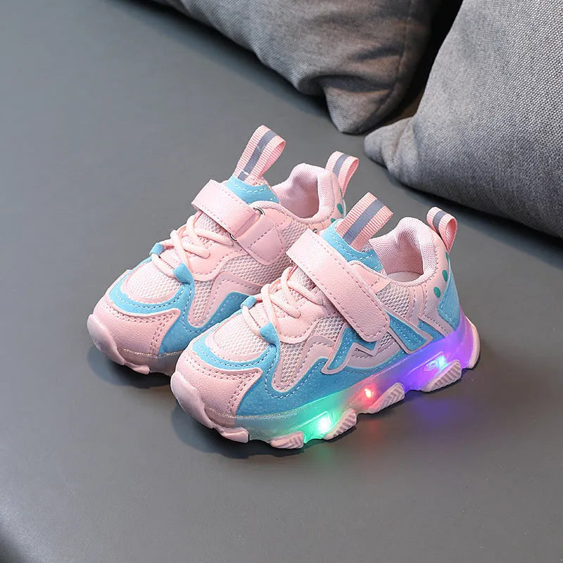 Black, pink, and grey children's Velcro sneakers with mesh panels and a rubber sole.