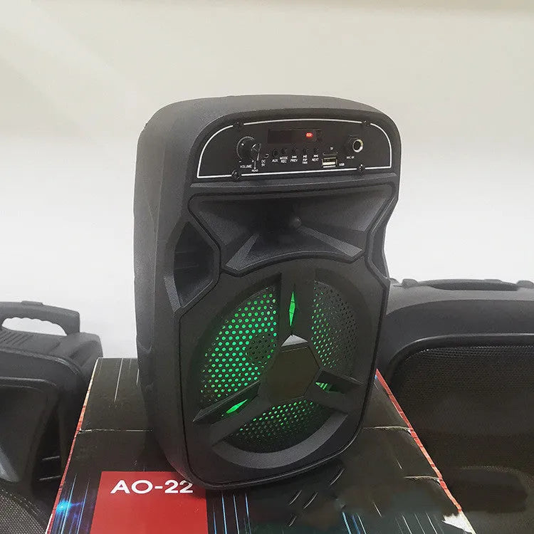 Black portable Bluetooth speaker with card slot and control buttons