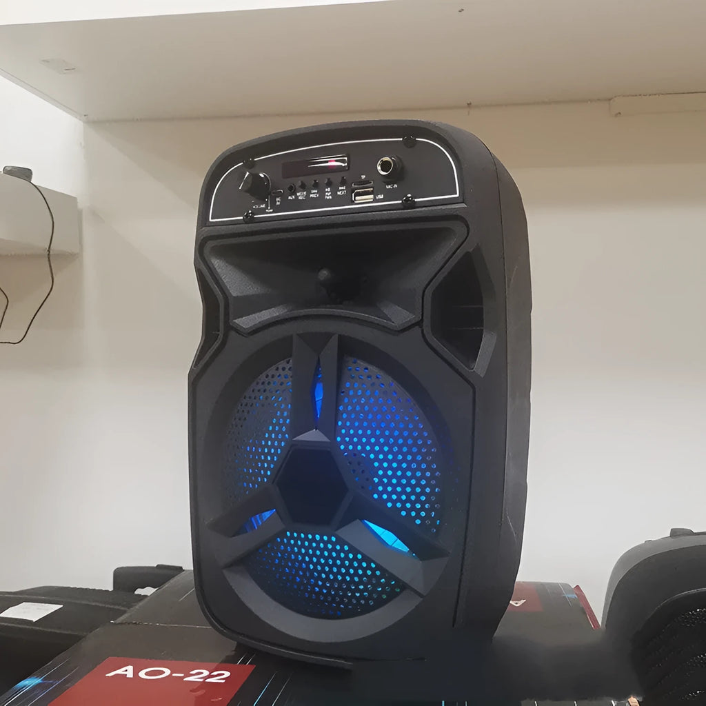 Black portable Bluetooth speaker with card slot and control buttons
