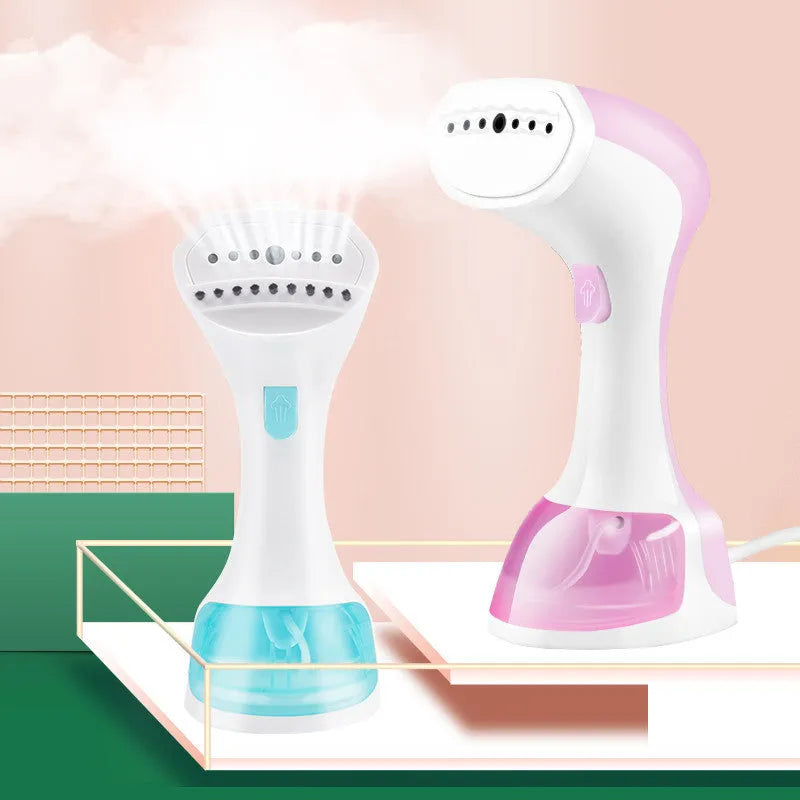 Mini portable handheld garment steamer with 0.9L water tank in green with brush accessory on white background