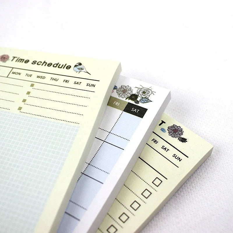 Compact work plan diary notebook showing four different design style options for weekly and monthly planning