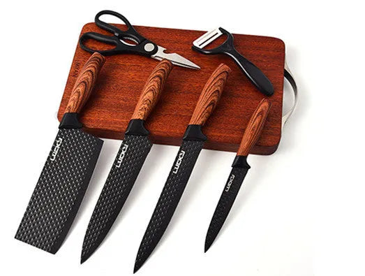 Six-piece stainless steel knife set with anti-rust coating and wheat straw handles in Suit style on a kitchen board