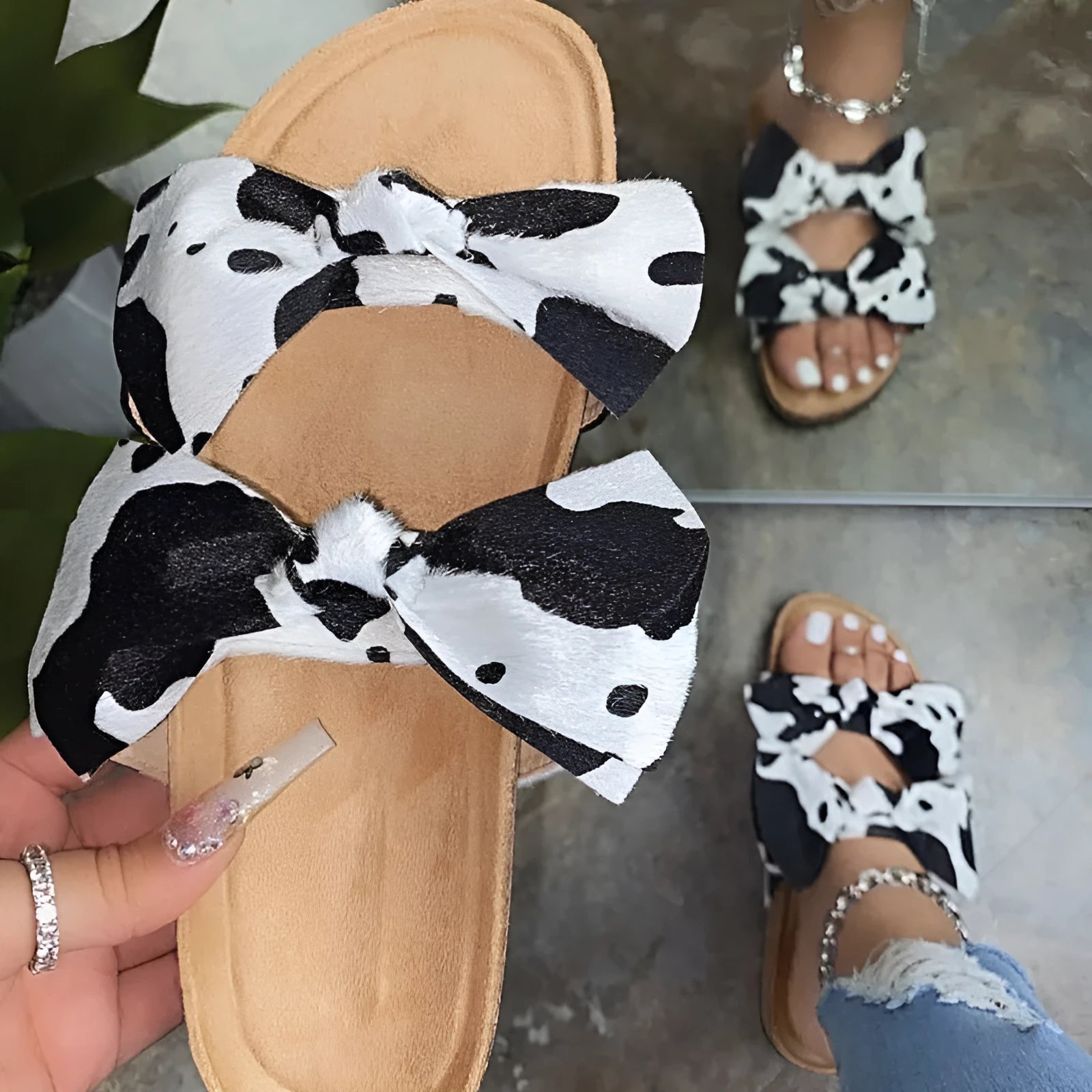 Women's suede flat slippers with bowknot detail in cream colour on tiled floor