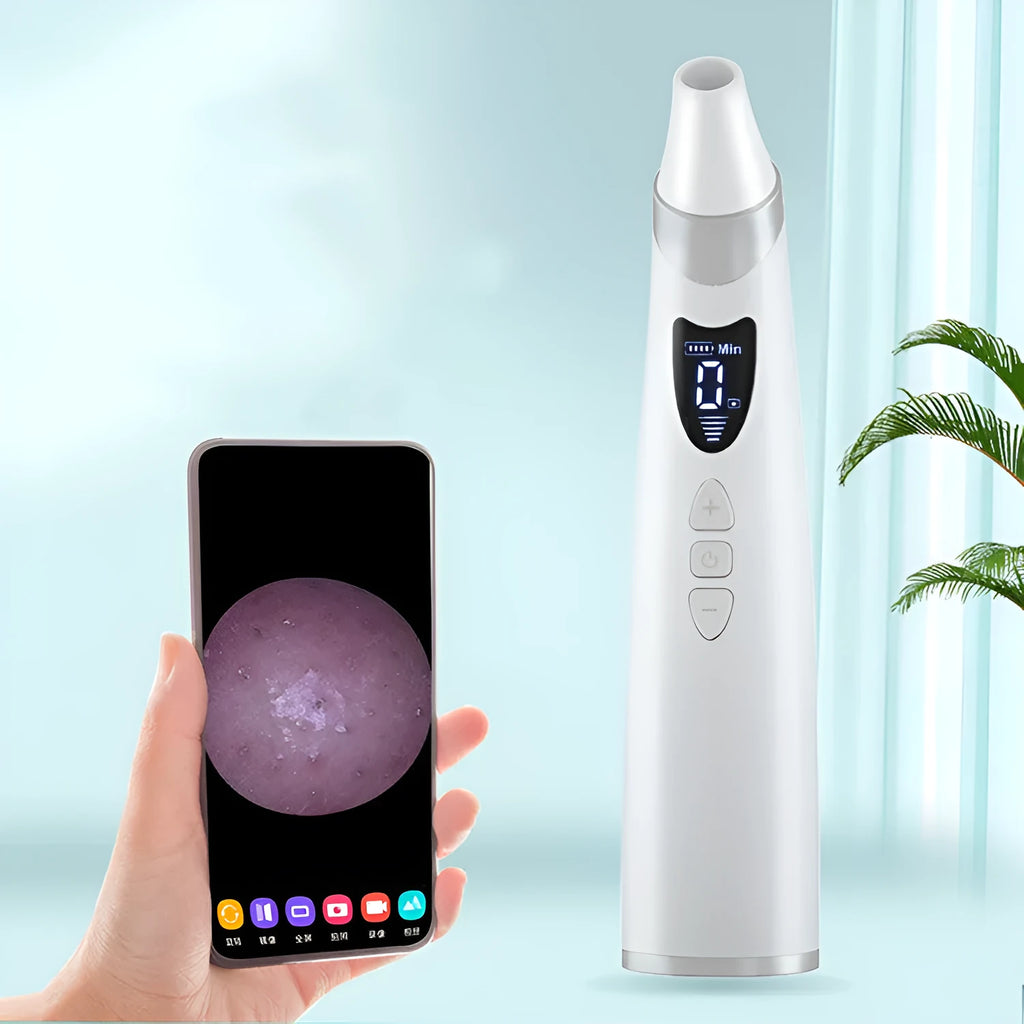 White electric visual blackhead suction instrument with LED display, four silicone heads, and USB charging cable on a sponge bag.