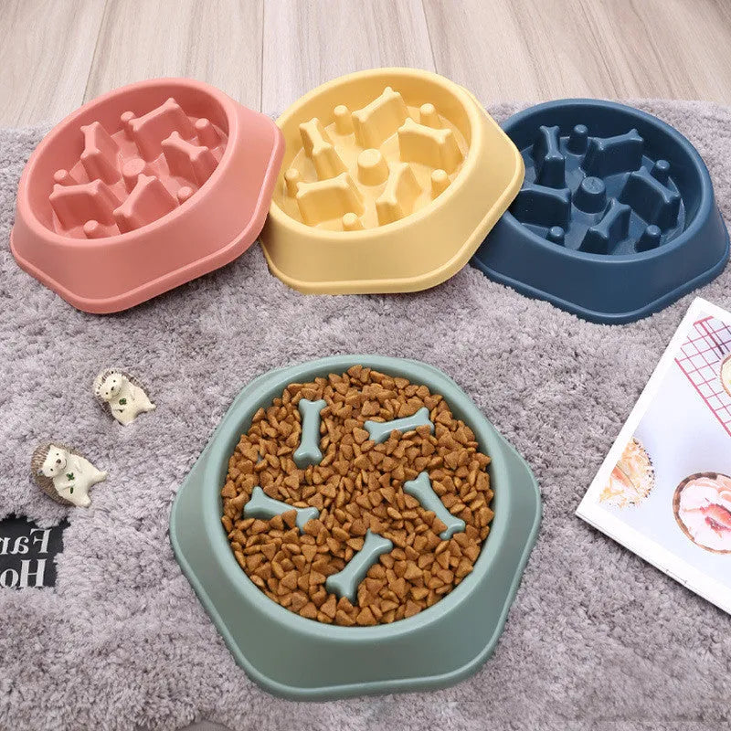 Household bone-shaped anti-choking slow food dog bowl in PP plastic, available in six colours, designed for slower canine feeding