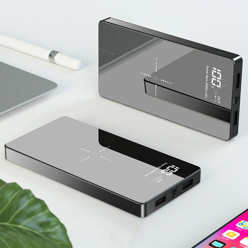 Black and white wireless charging power bank with digital display showing 20000 mAh capacity