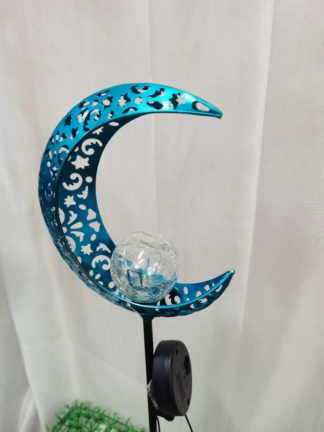 Blue solar garden light with hollow wrought iron moon design and moon crack glass ball