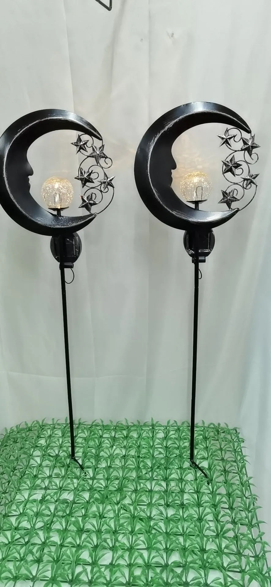 Blue solar garden light with hollow wrought iron moon design and moon crack glass ball