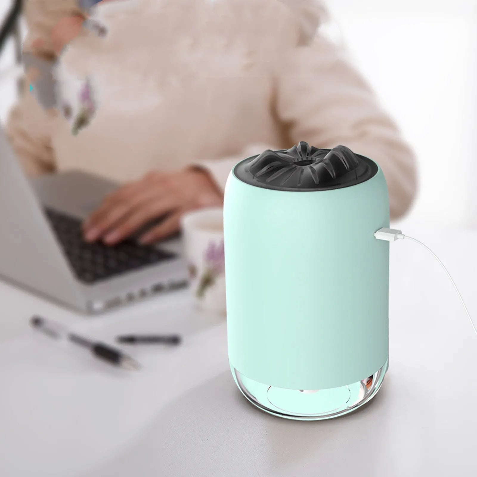 Magic Flame white mini ultrasonic humidifier with USB cable on desktop, columnar shape