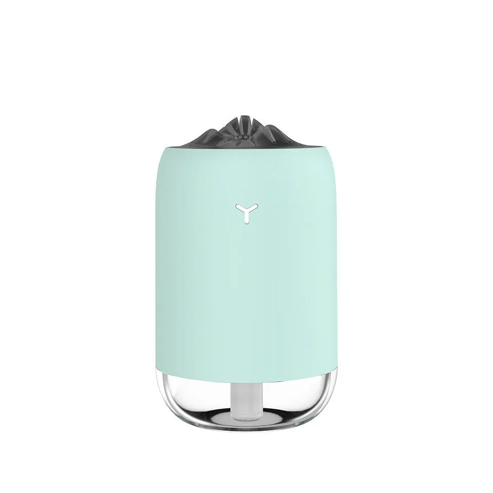 Magic Flame white mini ultrasonic humidifier with USB cable on desktop, columnar shape