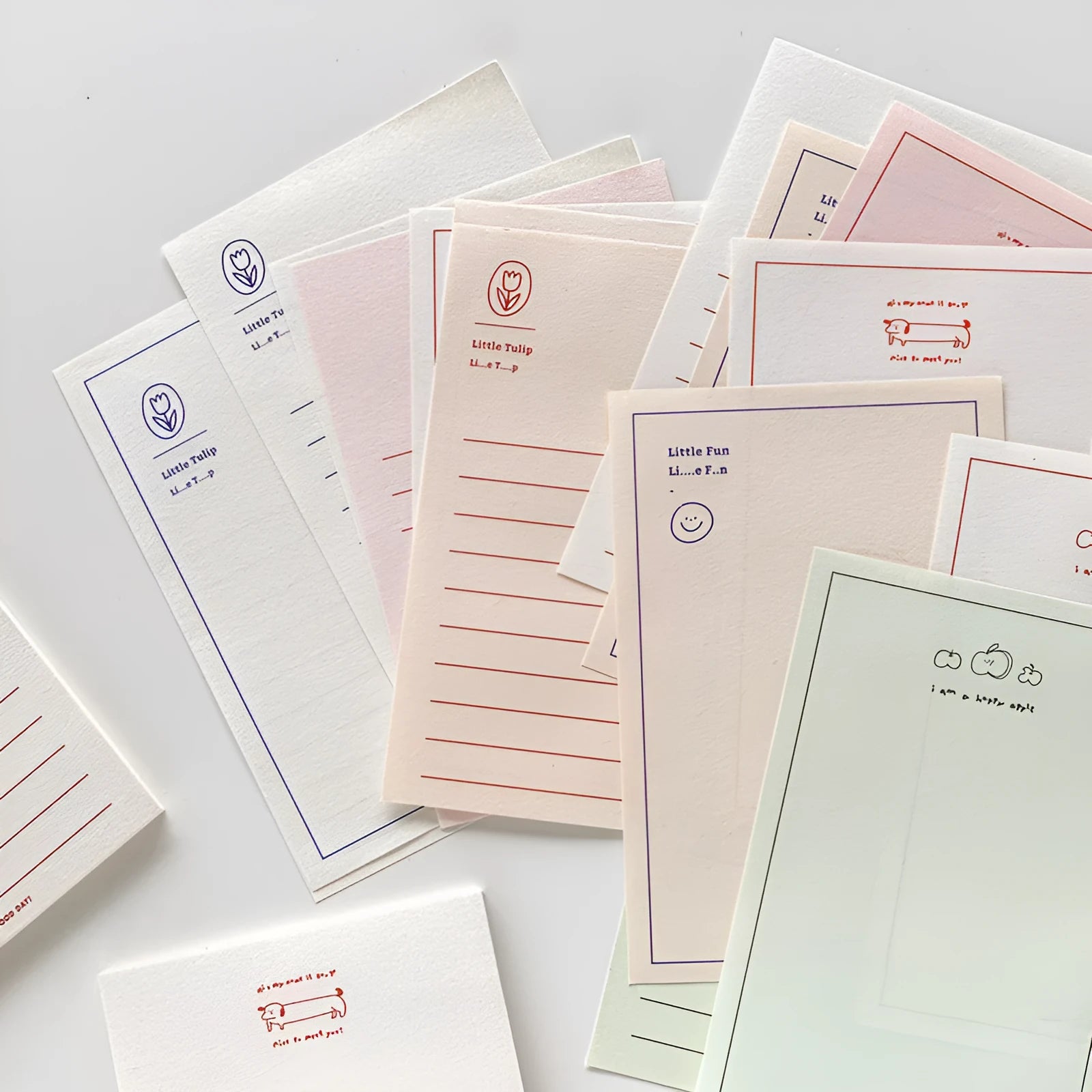 A rectangular memo pad notebook with a choice of paper cover designs, shown open to reveal blank or lined writing pages.