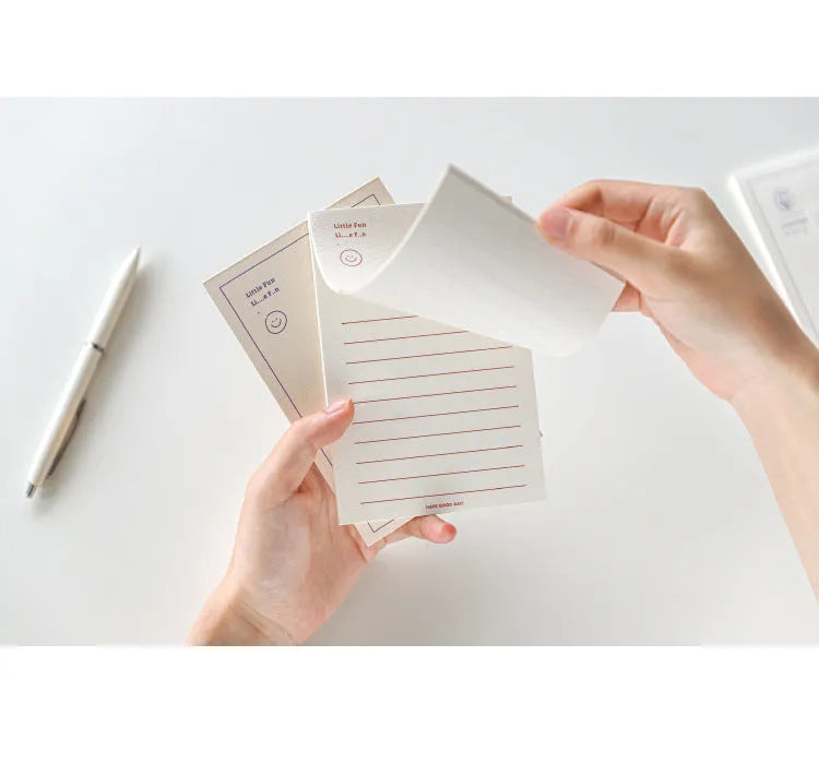 A rectangular memo pad notebook with a choice of paper cover designs, shown open to reveal blank or lined writing pages.