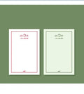 A rectangular memo pad notebook with a choice of paper cover designs, shown open to reveal blank or lined writing pages.