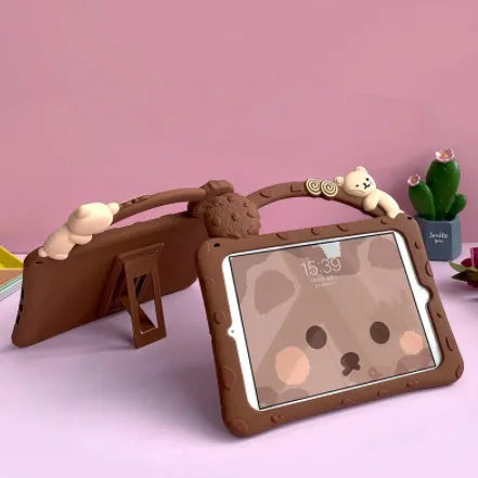 Brown cartoon design silicone case with built-in stand for iPad, showing port cutouts.