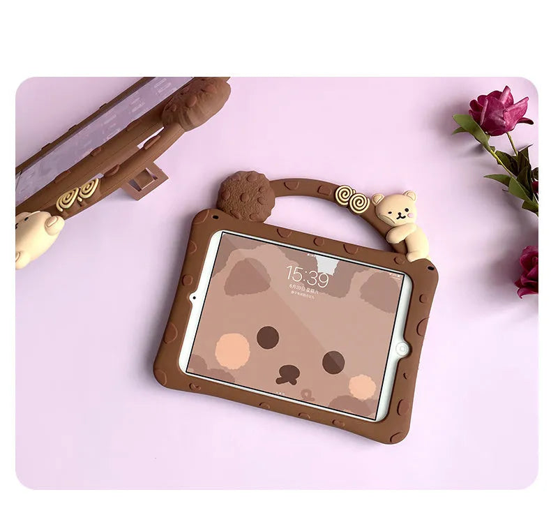 Brown cartoon design silicone case with built-in stand for iPad, showing port cutouts.