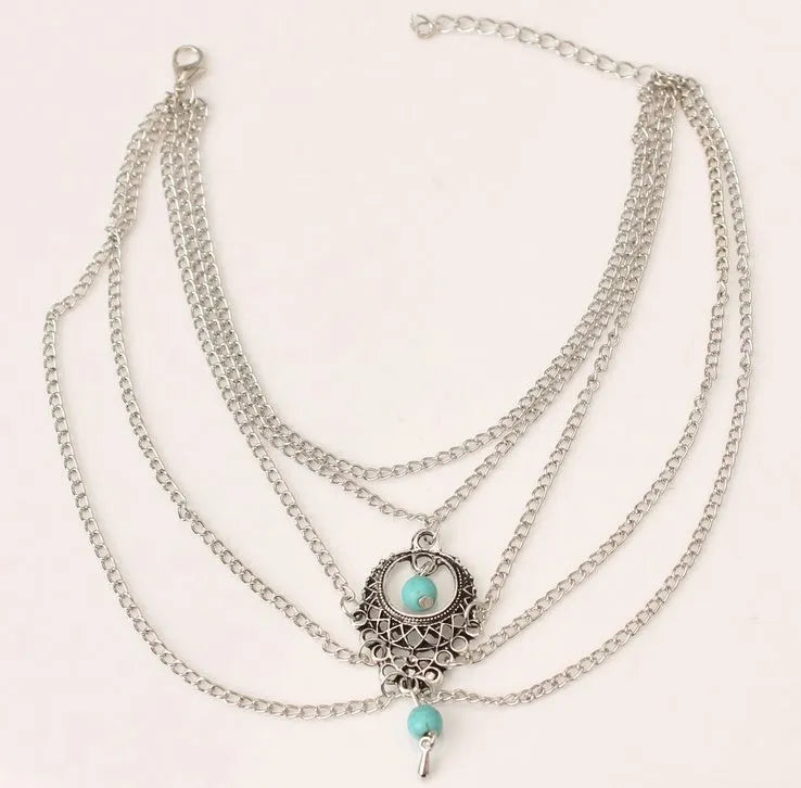 Bohemian chain anklet in Ancient Silver, 21 cm length, 2.3 cm width, on a plain background