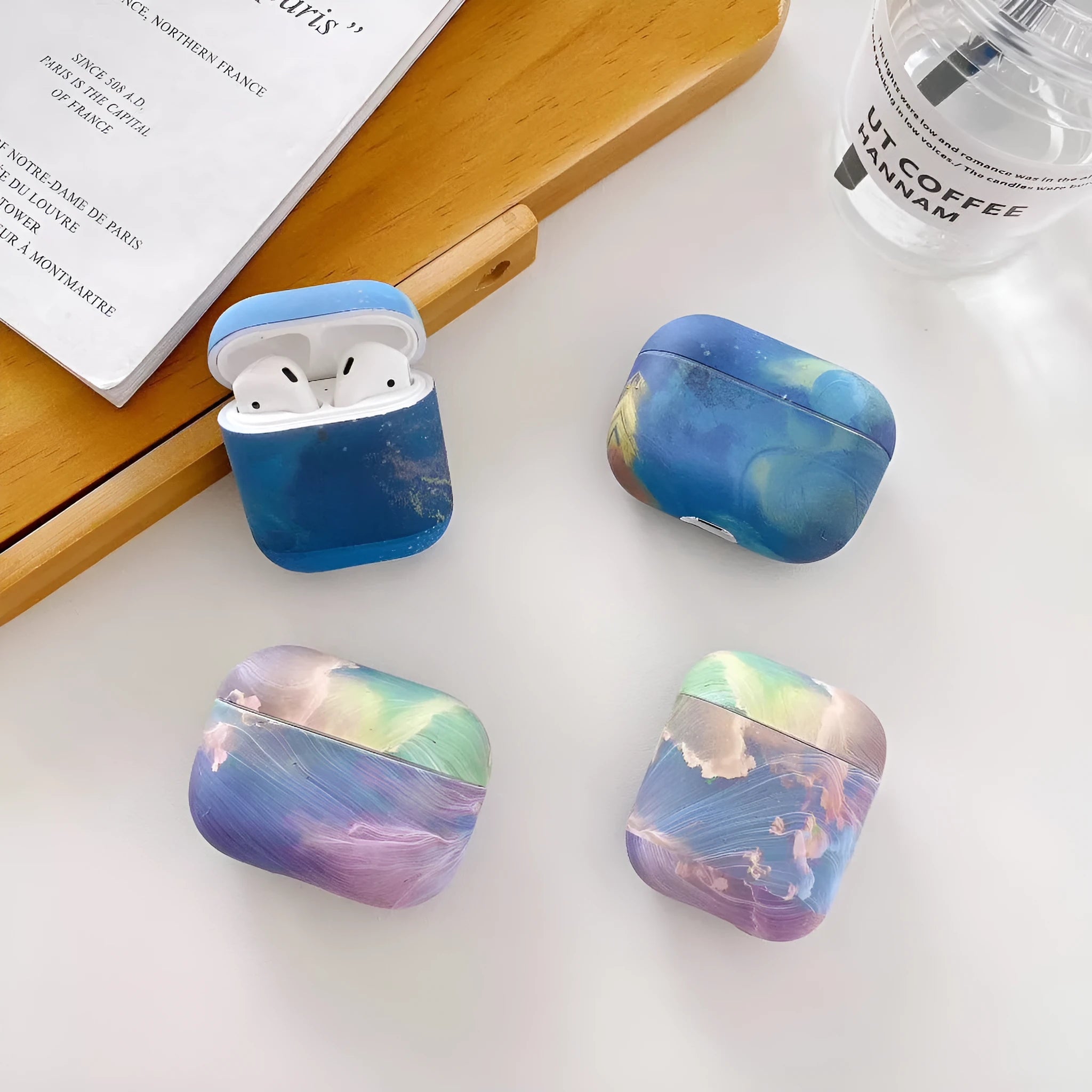 Blue and pink watercolour design hard plastic protective sleeve for Apple AirPods Pro and AirPods cases.