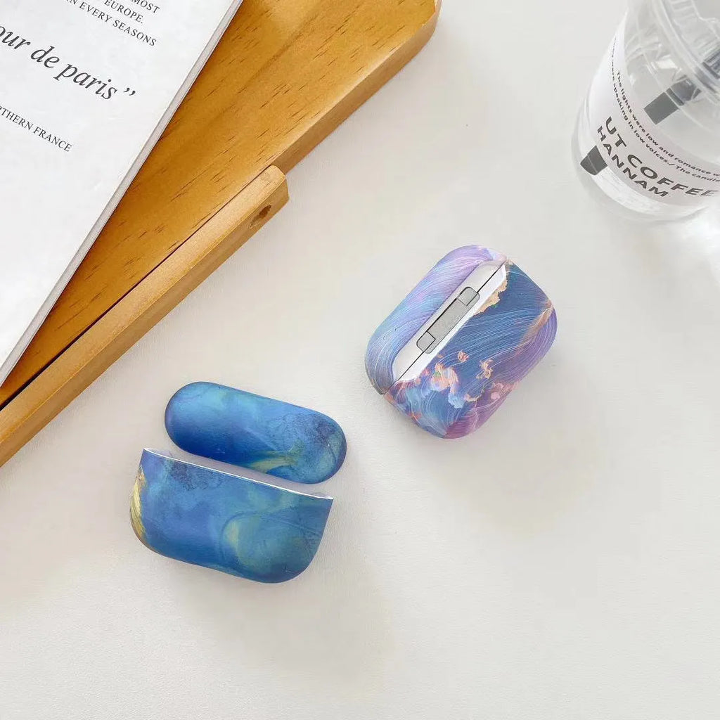 Blue and pink watercolour design hard plastic protective sleeve for Apple AirPods Pro and AirPods cases.