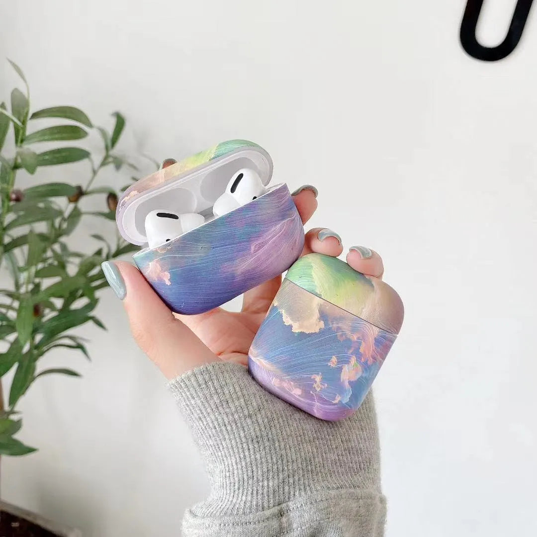 Blue and pink watercolour design hard plastic protective sleeve for Apple AirPods Pro and AirPods cases.