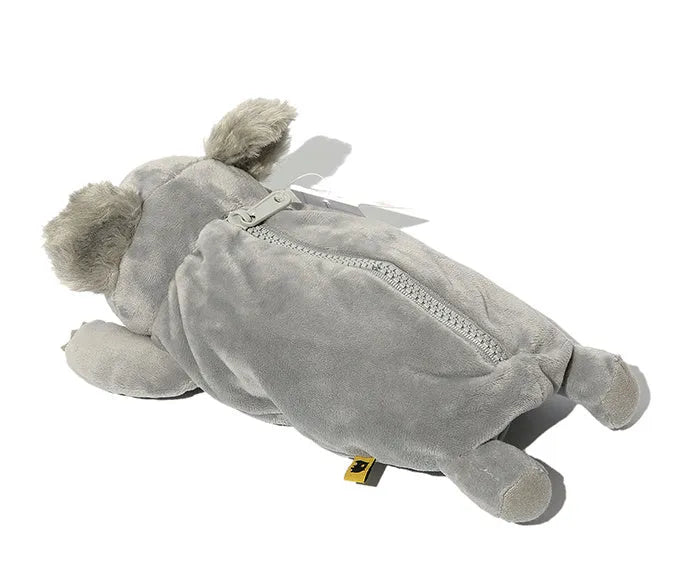 Brown plush wombat cartoon animal pencil case with zip, shown next to pens and pencils.