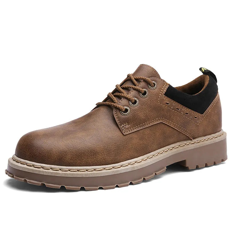 Men's black casual shoes with round toe, front lace-up, and flat rubber sole on a neutral background