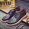 Men's black casual shoes with round toe, front lace-up, and flat rubber sole on a neutral background