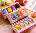 Set of 12 colourful cartoon erasers shaped like ice cream cones, donuts, and lollipops for children.