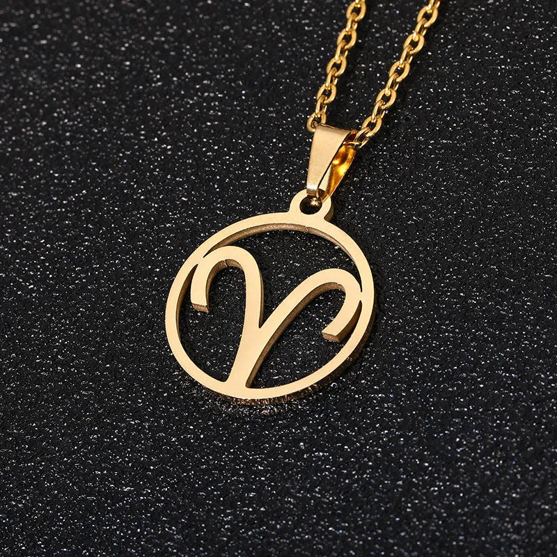 Set of 12 stainless steel horoscope pendant necklaces with vacuum plating gold finishes on a white background