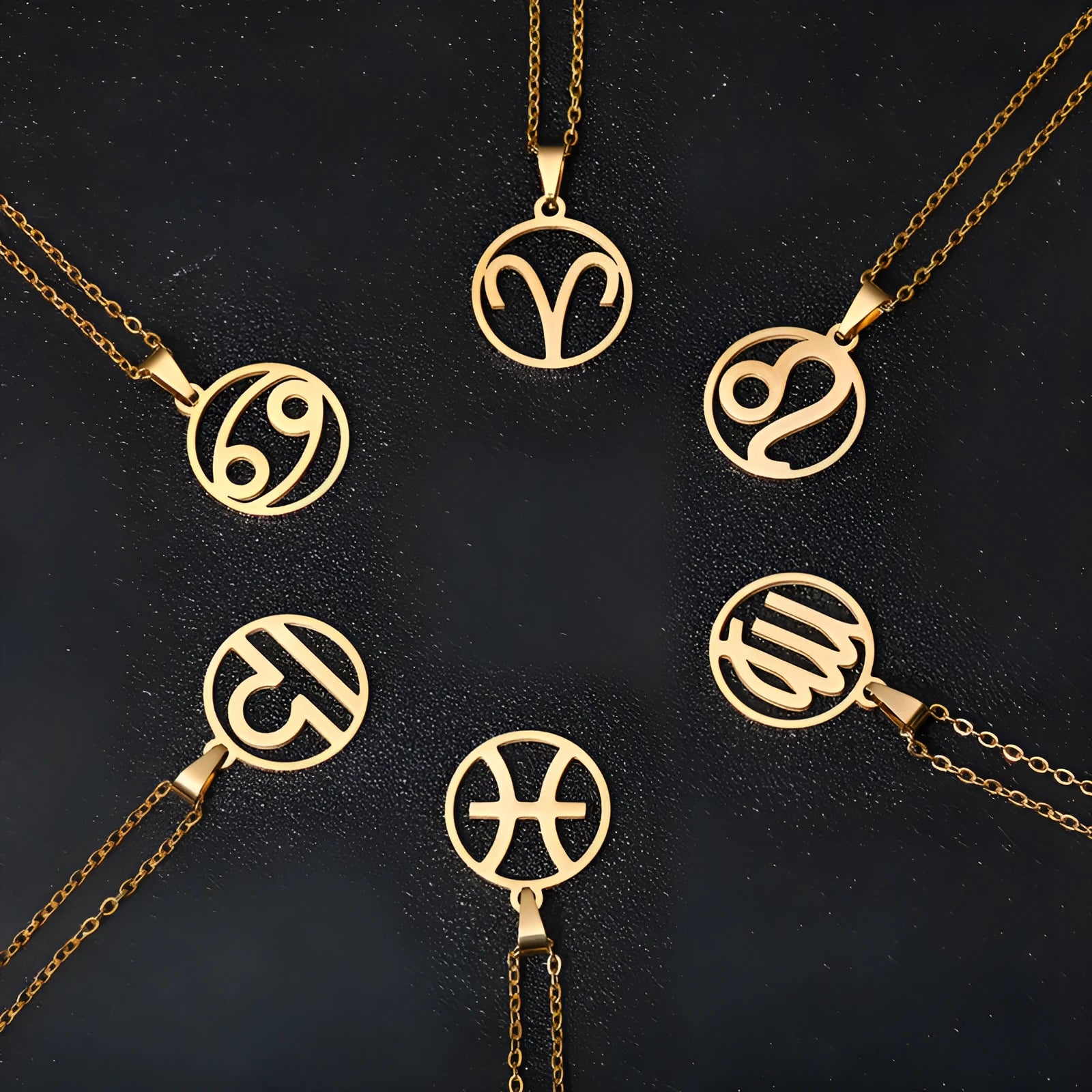 Set of 12 stainless steel horoscope pendant necklaces with vacuum plating gold finishes on a white background
