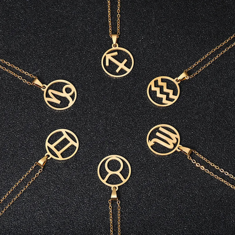 Set of 12 stainless steel horoscope pendant necklaces with vacuum plating gold finishes on a white background