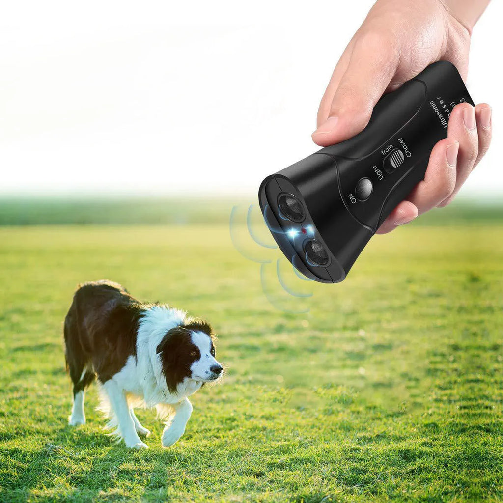 Double Horn Laser Dog Trainer with plastic casing, 14cm length, and wrist strap on a plain background