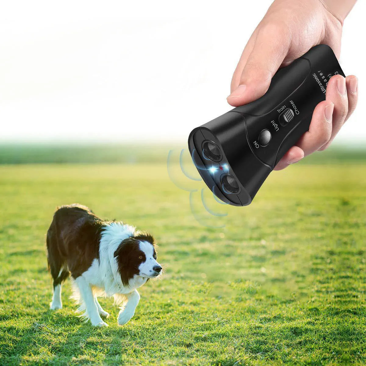 Double Horn Laser Dog Trainer with plastic casing, 14cm length, and wrist strap on a plain background