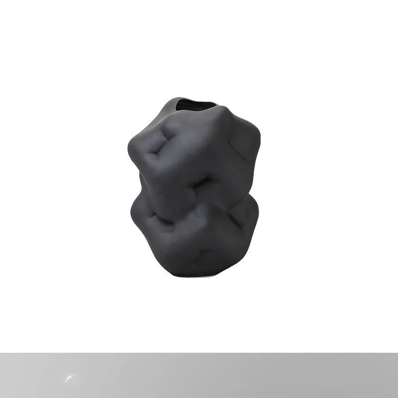 Ceramic flower vase with irregular concave-convex surface in white, 26x25x34cm, on a wooden table