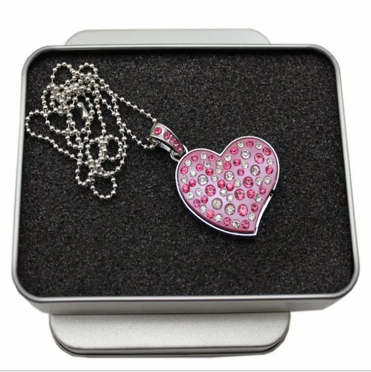 Heart shaped USB flash drive with metal shell, drill hole and USB 2.0 connector.