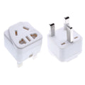 White and black UK three-pin to international power conversion adapter with grounding pins